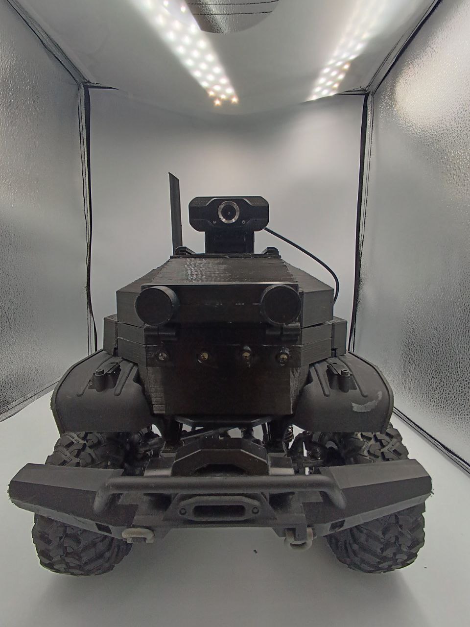 Front view of the completed RC car with USB camera mounted above its custom enclosure