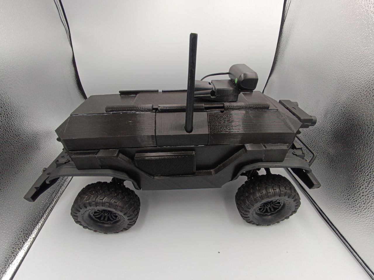 Side view of the completed mobile Banalytics Agent RC car with enclosed electronics, camera and LTE antenna