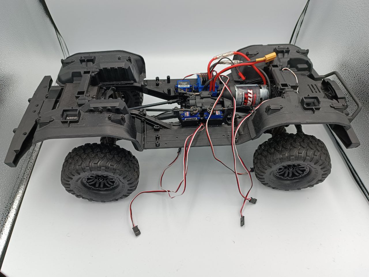Bare RC car chassis showing the motor, steering servos and drivetrain before the edge computer was installed