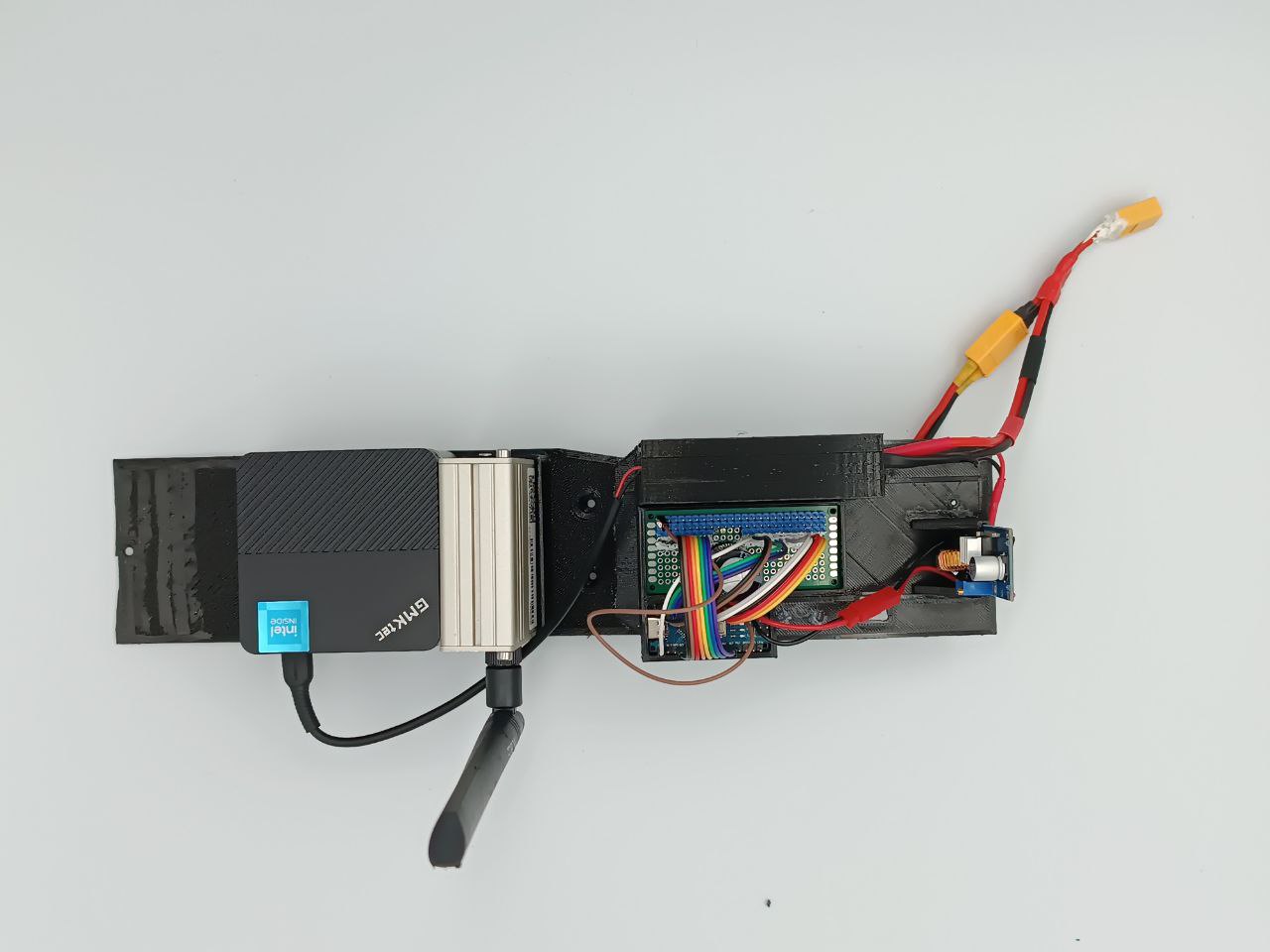 Mini PC, LTE modem, Arduino controller and power conversion mounted on a removable RC car control deck